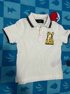 AMIRI White Kids Polo with Yellow Tiger Patch and Black Trim